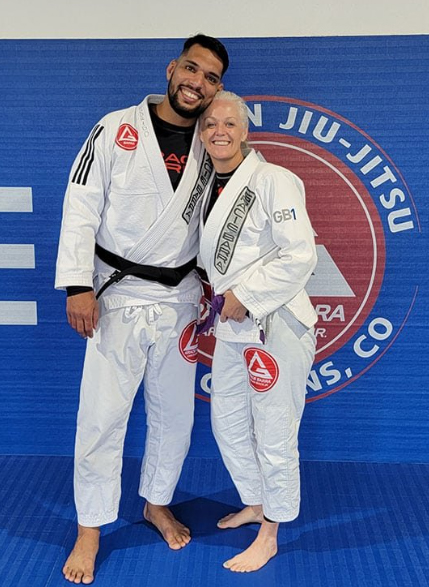 Prof Seidler Rodrigo and Professor Andrea Warner posing at Gracie Barra Fort Collins, CO