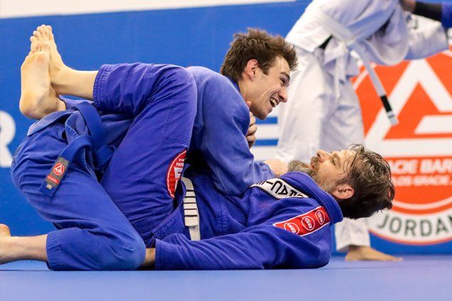 two male Jiu Jitsu students practicing 