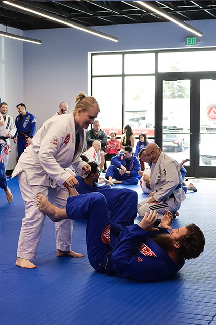 Adults drilling technique in a Fundamentals Jiu-Jitsu class at Gracie Barra Riverton