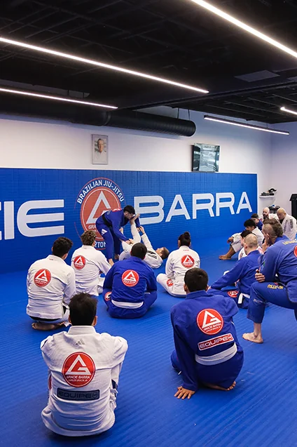 Instructor welcoming a new student at Gracie Barra Riverton