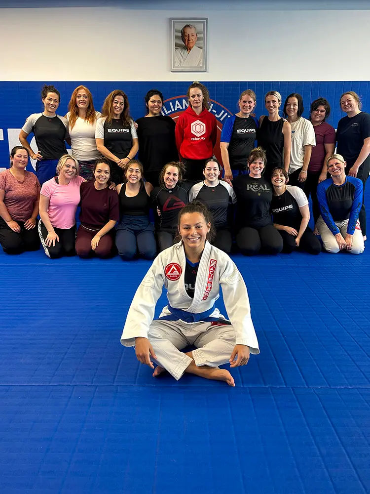 Coach Kaitlyn Ceballos teaching a women's Jiu-Jitsu class