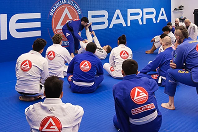 A Brazilian Jiu-Jitsu class training on the mats at Gracie Barra Riverton
