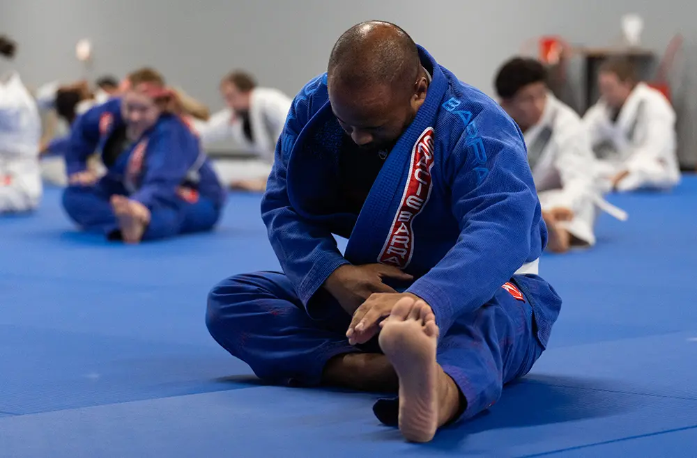 Adults training Brazilian Jiu-Jitsu at Gracie Barra Riverton