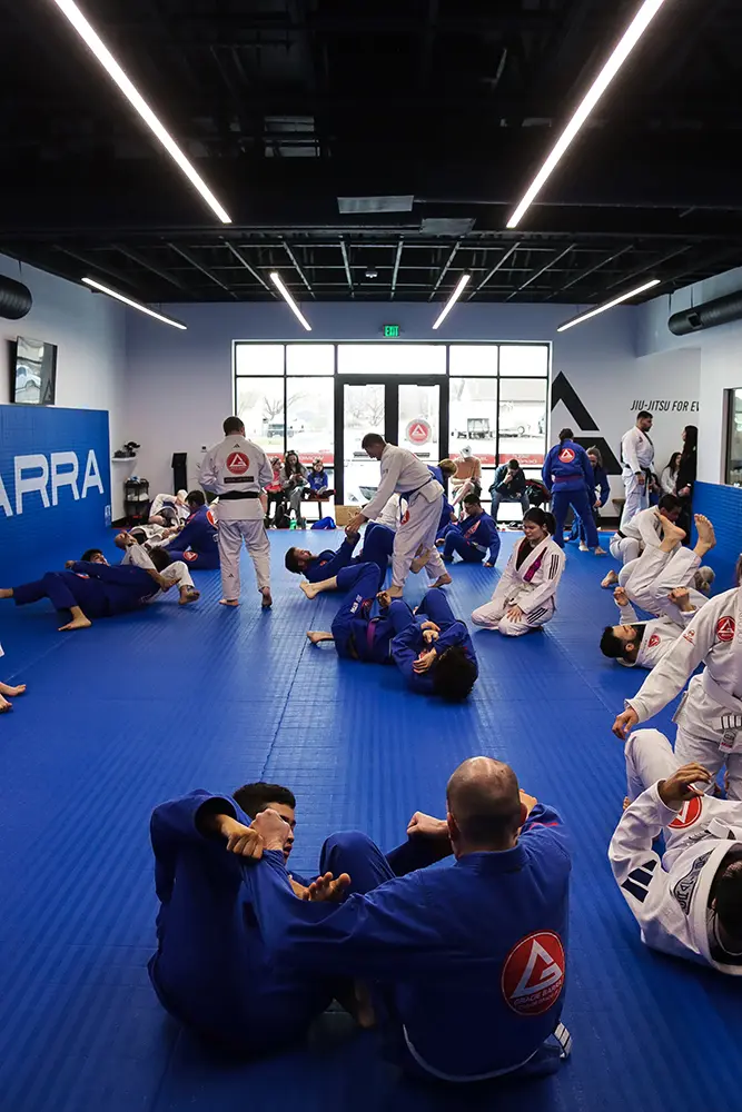 Instructor coaching a student at Gracie Barra Riverton in Riverton, Utah
